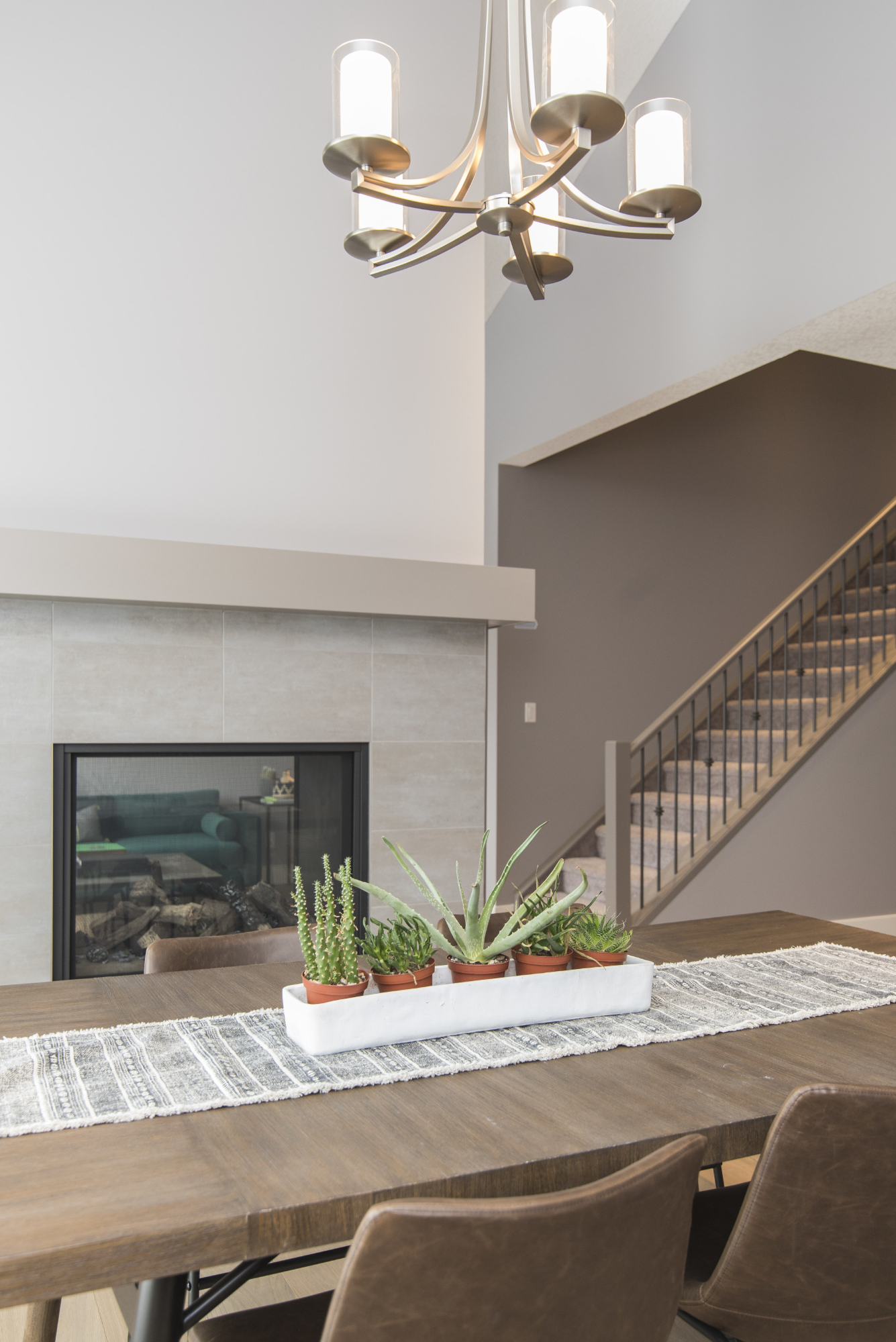 beautiful shot modern house dining room with plants fireplace