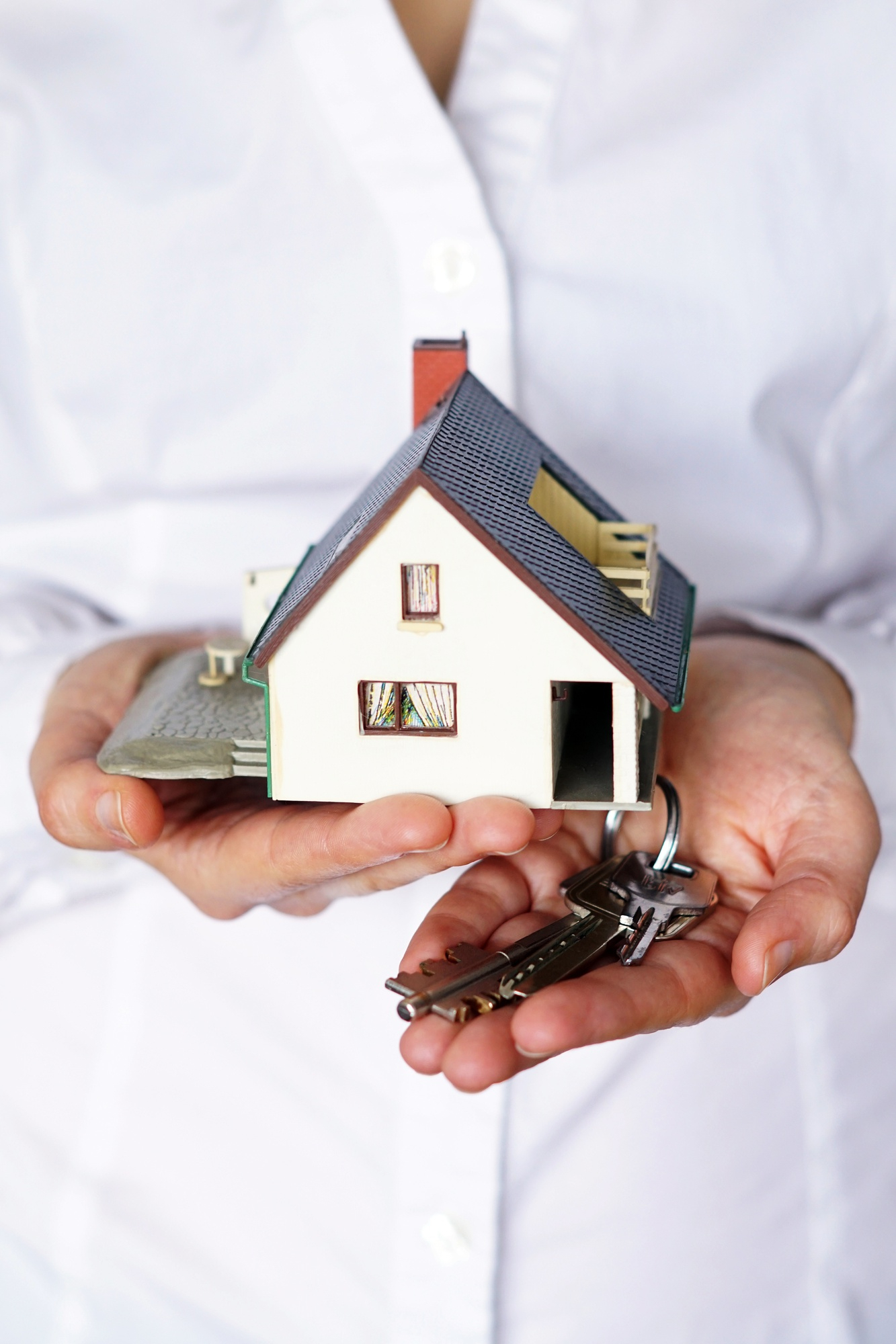 vertical closeup shot person thinking buying selling house